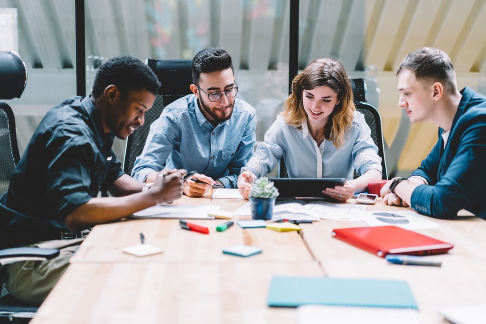 Multicultural,Group,Of,Professional,Designers,Collaborating,On,Task,Using,Modern home image, people working successfully